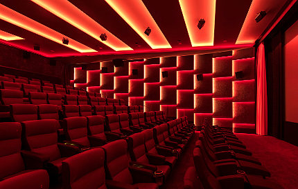 The conference room at Astor Film Lounge, showing cinema seats and the cinema screen